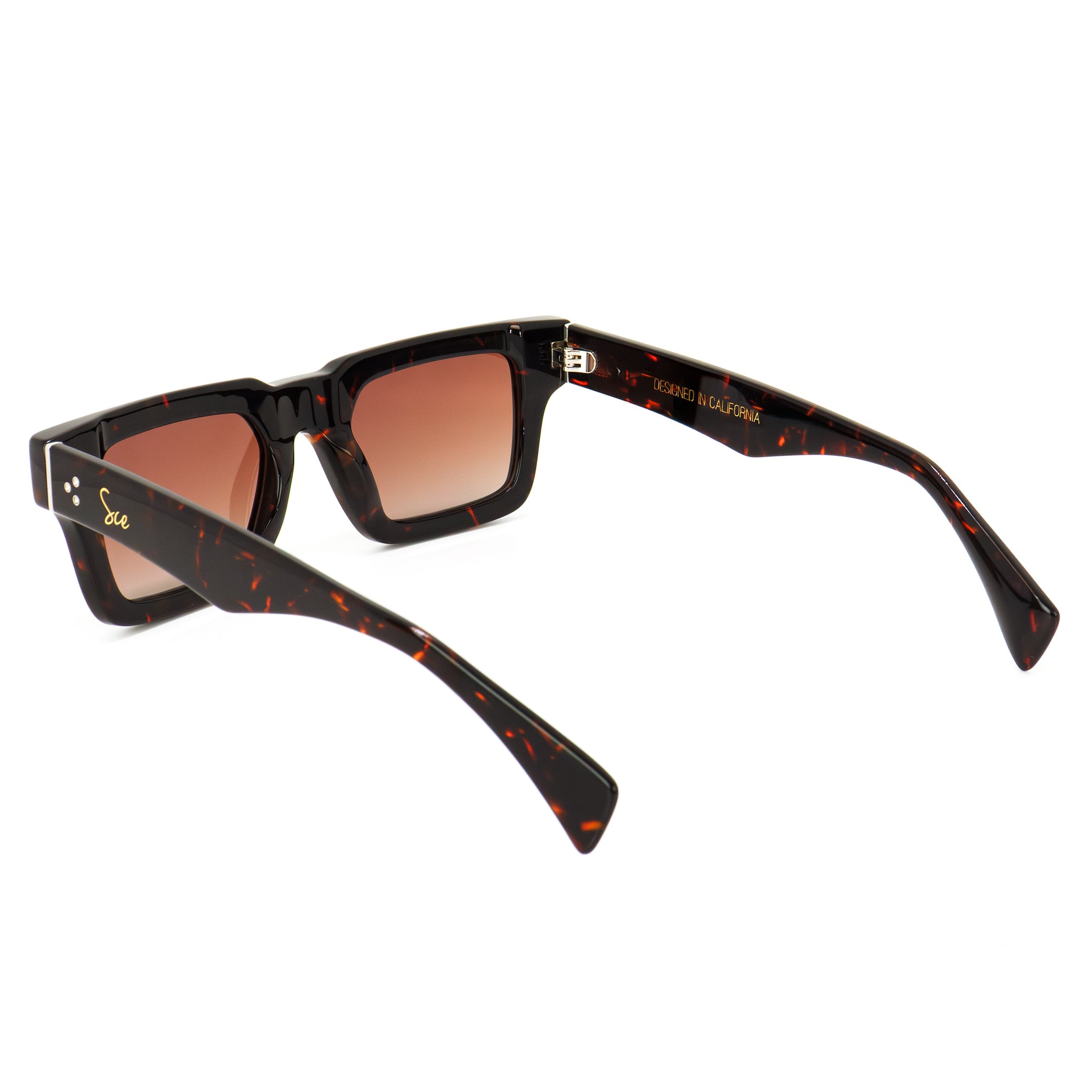 Angled top view of Soul California Eyewear Elaris sunglasses highlighting the sculpted ebony acetate frame with brown gradient polarized lenses.