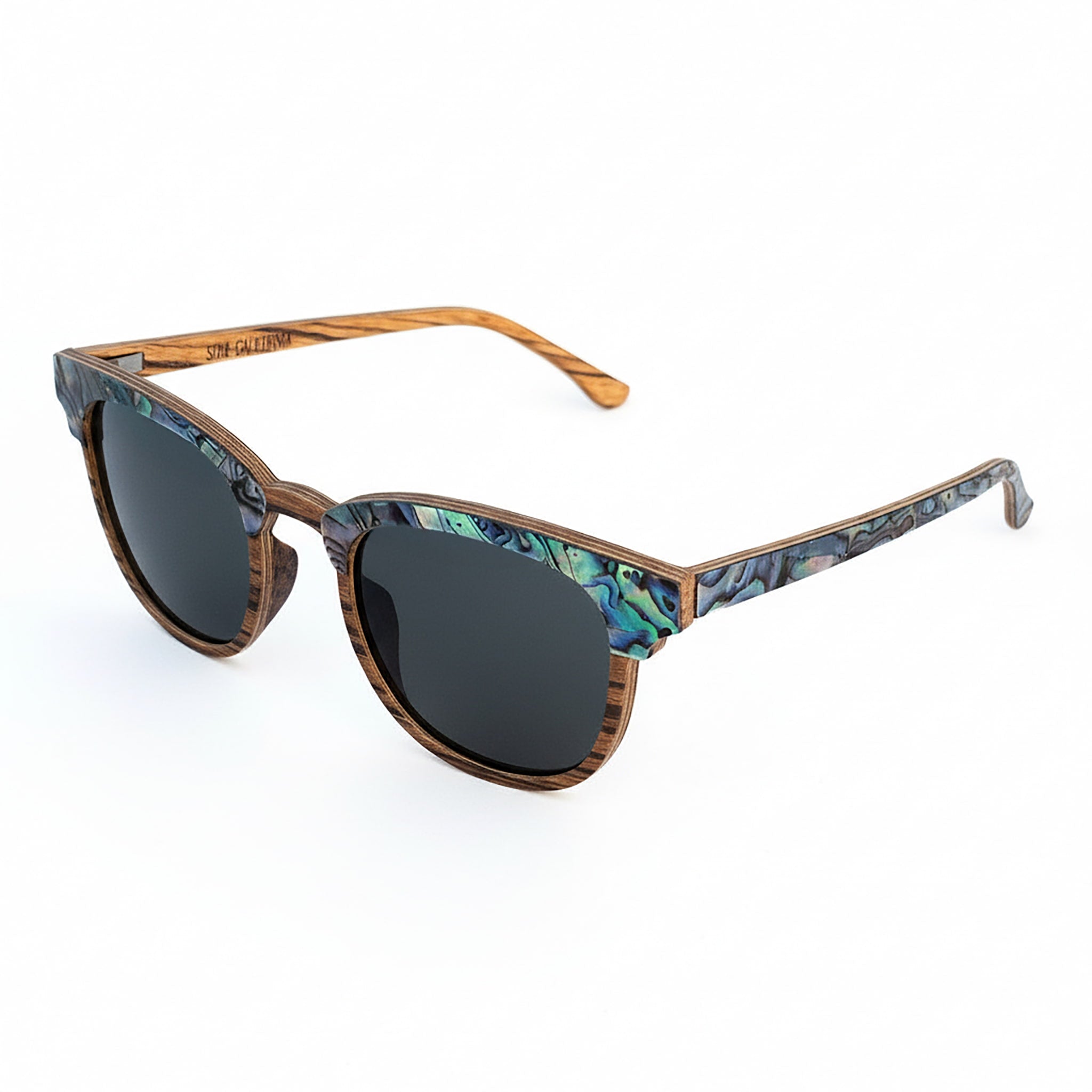 Angled top view of Soul California Eyewear Pebble Beach Dusk sunglasses highlighting abalone shell detail and smooth handcrafted zebra wood frame.