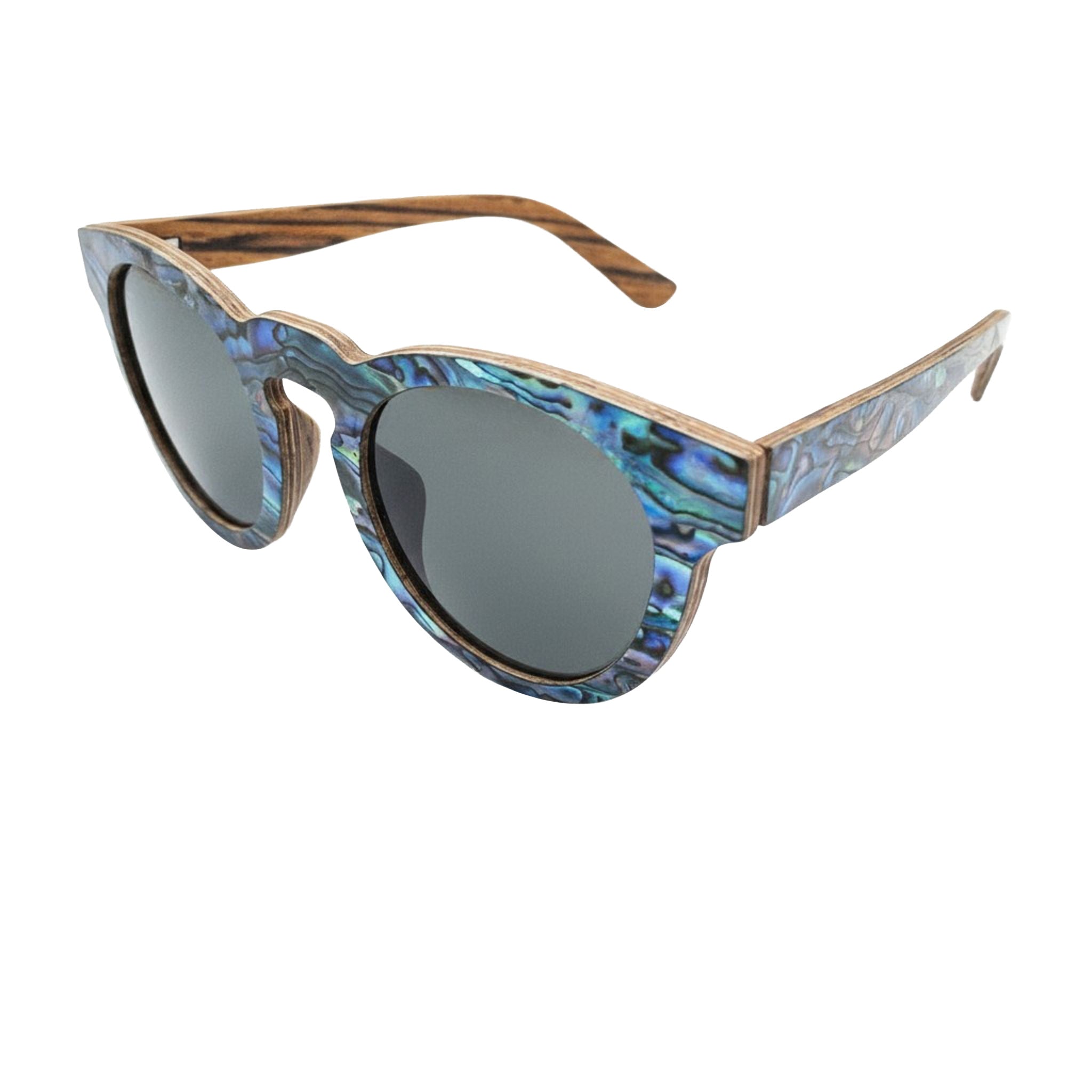 Angled top view of Soul California Eyewear Pfeiffer Beach Dusk sunglasses highlighting handcrafted Zebra Wood, New Zealand Abalone Paua Shell accents, and polarized light black lenses.
