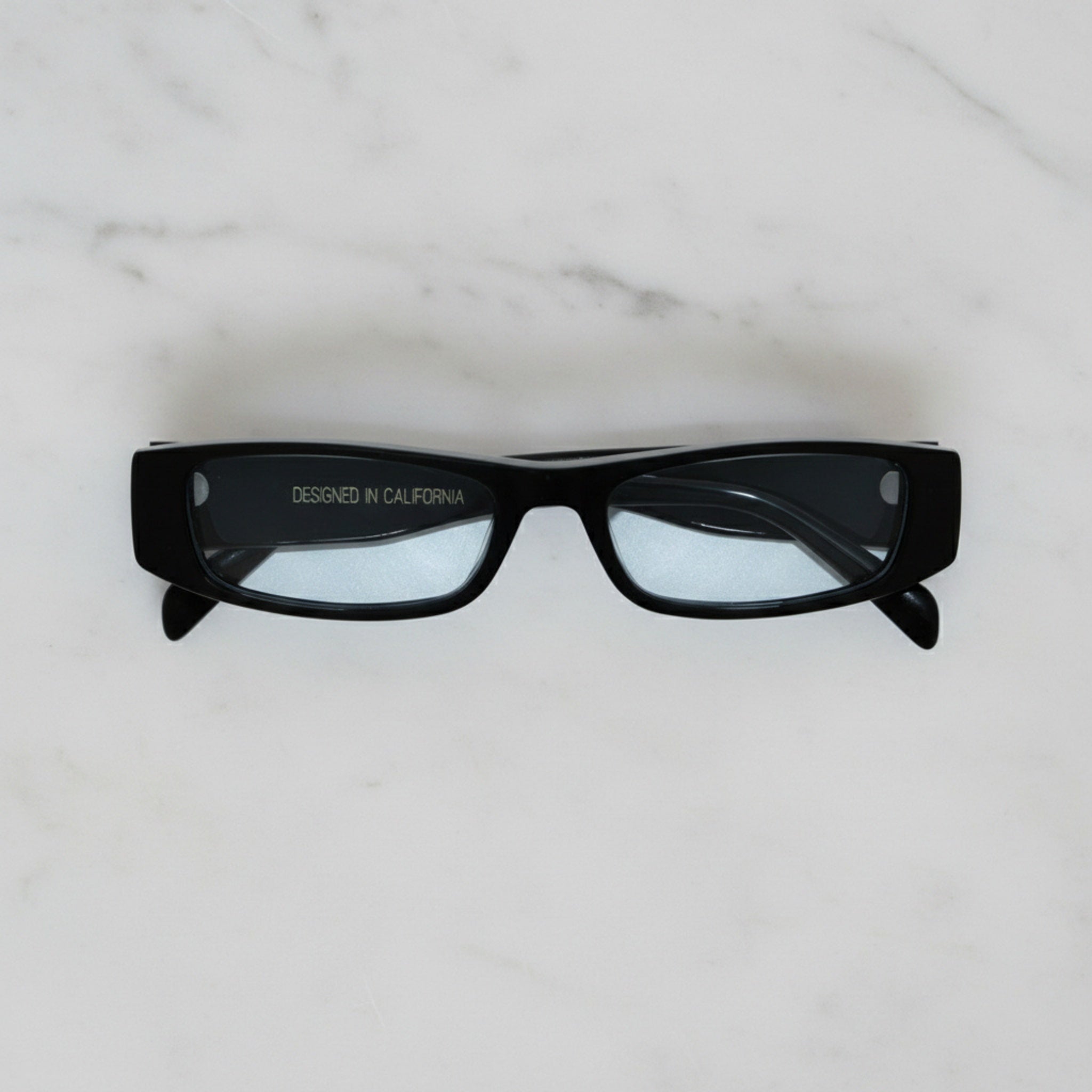 Soul California Eyewear Varin sunglasses front view in black with light blue UV-protected lenses.